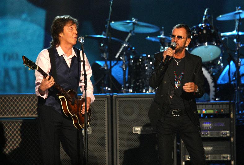 Paul McCartney and Ringo Starr perform at The Night that Changed America: A Grammy Salute to the Beatles, on Monday, Jan. 27, 2014, in Los Angeles. (Photo by Zach Cordner/Invision/AP)