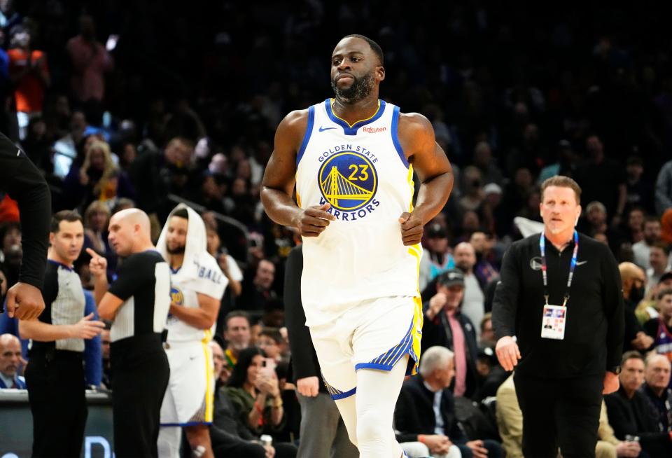 Golden State Warriors forward Draymond Green runs off the court after being ejected from the game after receiving a Flagrant Foul, Penalty 2 for hitting Phoenix Suns center Jusuf Nurkic in the face in the second half at Footprint Center on Dec 12, 2023.