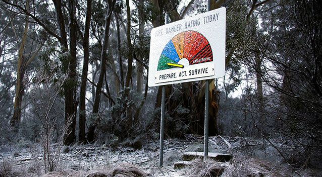 A sign displaying the obvious low risk of bush fire in Mount Victoria covered in ice last year. Source: Reuters.