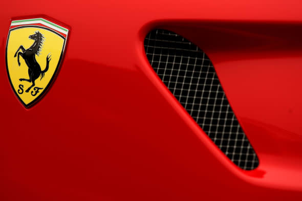 File photo dated 16/03/11 of a Ferrari badge on a car as the Italian supercar company raced to a record year in 2013 on the back of expanding UK sales. PRESS ASSOCIATION Photo. Issue date: Wednesday February 19, 2014. The company made an all-time high net profit of 264 million euros (?217 million) - a 5.4% rise on 2012. A total of 677 Ferraris were sold in the UK, with the nation overtaking Germany as the company's strongest European market. See PA story TRANSPORT Ferrari. Photo credit should read: Dave Thompson/PA Wire