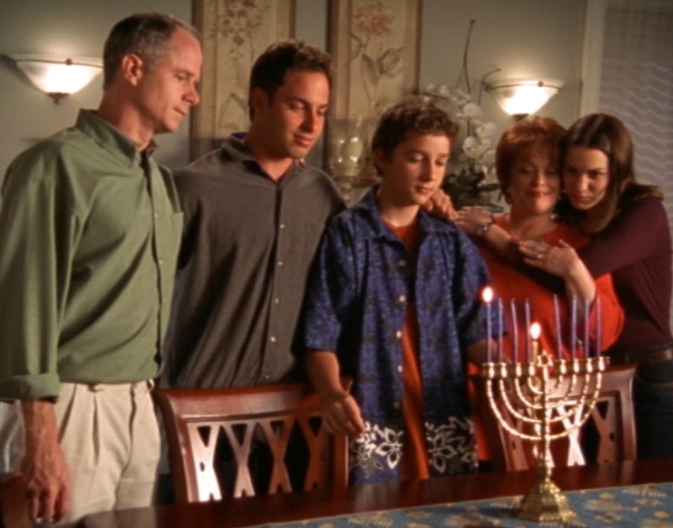 The Stevens Family gathers for a menorah lighting to celebrate Hanukkah in "Even Stevens"