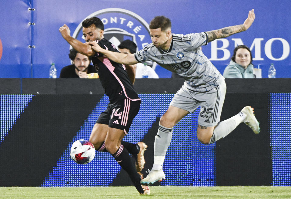 CF Montreal's Gabriele Corbo (25) challenges Inter Miami's Jean Corentin (14) during second-half MLS soccer match action in Montreal, Saturday, May 27, 2023. (Graham Hughes/The Canadian Press via AP)