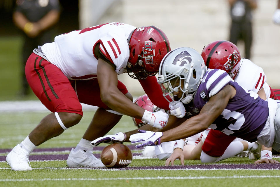 Kansas State defensive back D.J. Render (23) recovers an on-side kick during the first half of an NCAA college football game against Arkansas State Saturday, Sept. 12, 2020, in Manhattan, Kan. (AP Photo/Charlie Riedel)