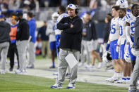 Duke head coach Mike Elko crosses his arms as he looks out to his team during the second half of an NCAA college football game against Virginia, Saturday, Nov. 18, 2023, in Charlottesville, Va. (AP Photo/Mike Caudill)