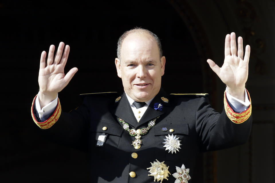 Prince Albert II of Monaco waves from the balcony of the Monaco Palace during the ceremonies marking the National Day in Monaco, Monday, Nov.19, 2018. (AP Photo/Claude Paris)