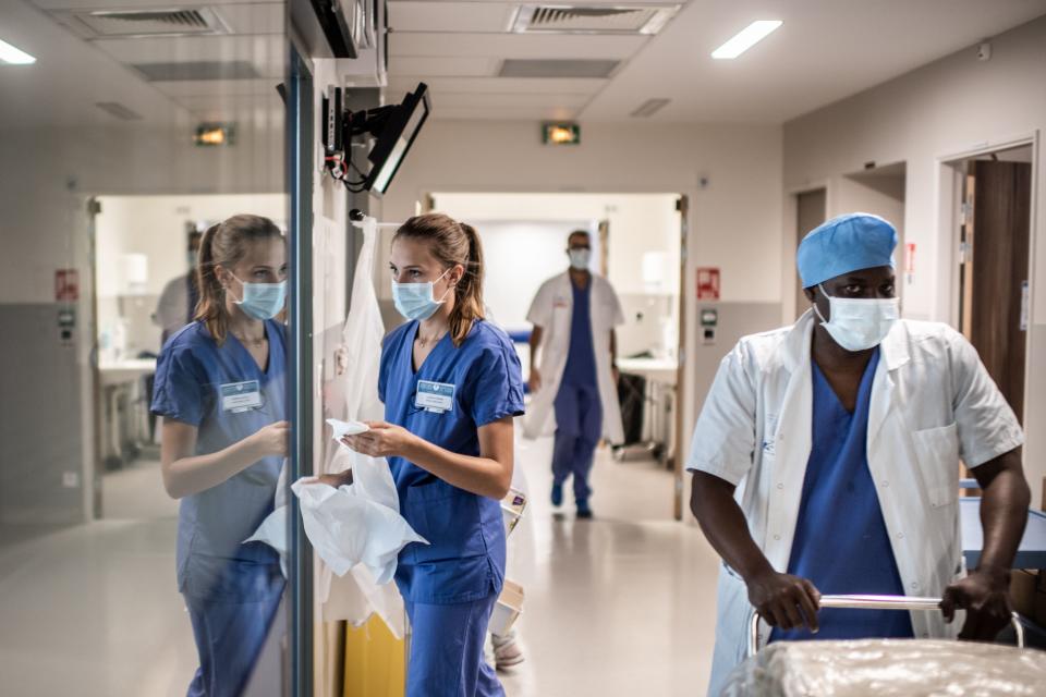 Healthcare employees work in the intensive care unit of Saint-Louis hospital in Paris, on May 28, 2020 as France eases lockdown measures taken to curb the spread of the COVID-19 (the novel coronavirus). (Photo by Martin BUREAU / AFP) (Photo by MARTIN BUREAU/AFP via Getty Images)