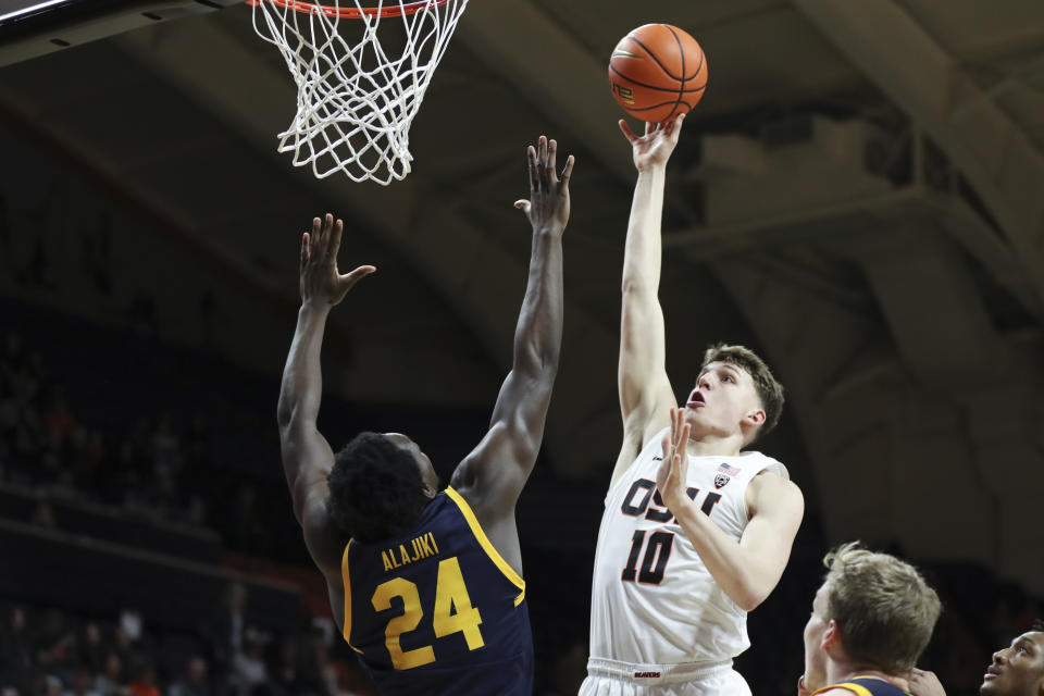 Oregon State forward Tyler Bilodeau (10) shoots as California forward Sam Alajiki (24) defends during the first half of an NCAA college basketball game in Corvallis, Ore., Saturday, March 4, 2023. (AP Photo/Amanda Loman)