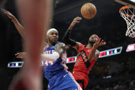 Toronto Raptors forward Jalen McDaniels (2) and Philadelphia 76ers forward Paul Reed (44) vie for the ball during the first half of an NBA basketball game Sunday, March 31, 2024, in Toronto. (Frank Gunn/The Canadian Press via AP)