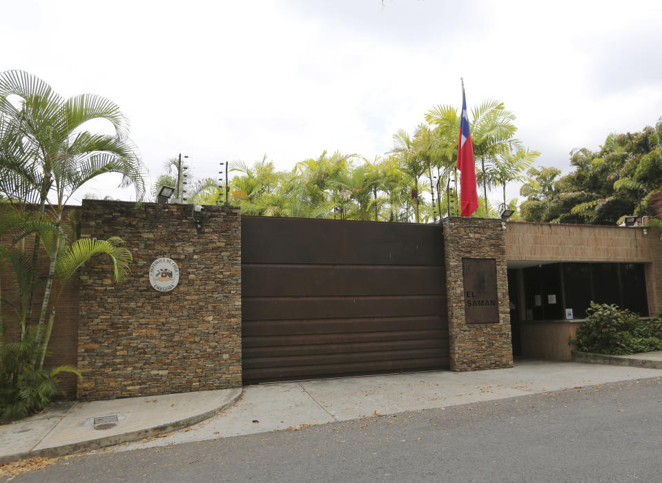 A Chilean national flag flies at the ambassador's residence in Caracas, Venezuela, Thursday, May 9, 2019. Some opposition-controlled National Assembly members are seeking refuge in diplomatic missions, including Chile, in a tactic reminiscent of 1970s-era dissidents scrambling for protection under the flags of other countries during the era of Latin American dictatorships. (AP Photo/Fernando Llano)