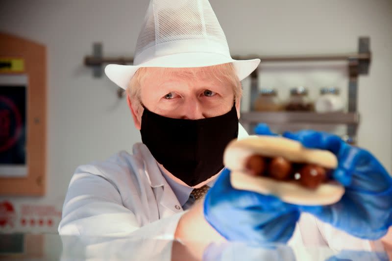 FILE PHOTO: Britain's PM Johnson and Health Secretary Hancock visit the Royal Berkshire Hospital in Reading