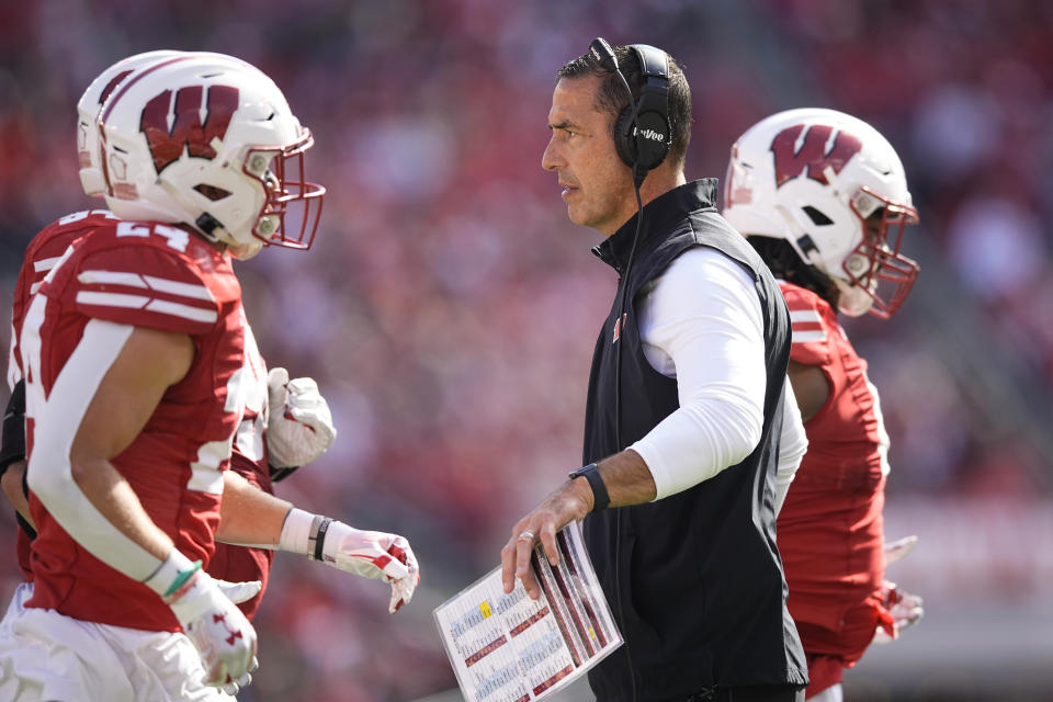 Oct 7, 2023; Madison, Wisconsin, USA; Wisconsin Badgers head coach Luke Fickell greets players during the third quarter against the Rutgers Scarlet Knights at Camp Randall Stadium. Mandatory Credit: Jeff Hanisch-USA TODAY Sports