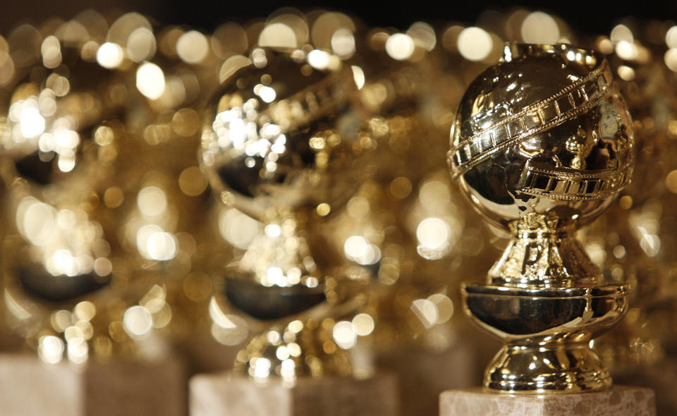 FILE - In this Jan.. 6, 2009, file photo, Golden Globe statuettes are seen during a news conference at the Beverly Hilton Hotel in Beverly Hills, Calif. The Hollywood Foreign Press Association says the ceremony will be held Feb. 28, 2021. (AP Photo/Matt Sayles, File)