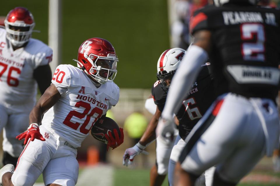 Houston running back Brandon Campbell (20) runs the ball against Texas Tech during the second half of an NCAA college football game Saturday, Sept. 10, 2022, in Lubbock, Texas. (AP Photo/Justin Rex)