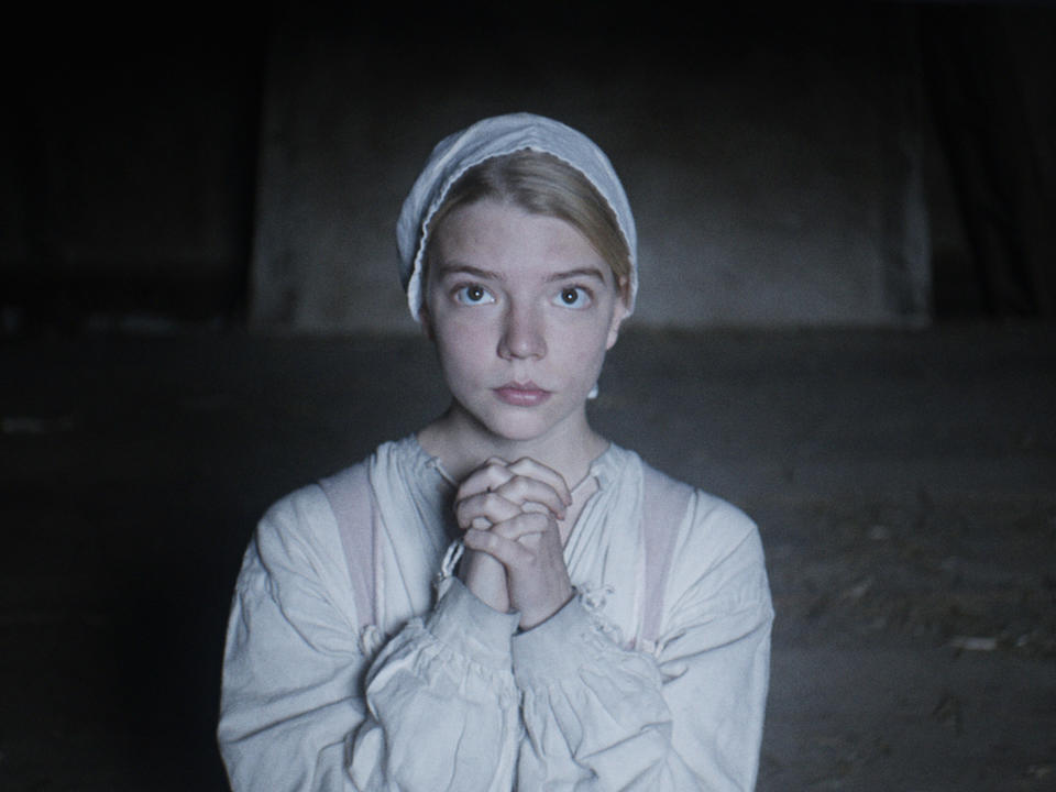 Thomasin praying in the film