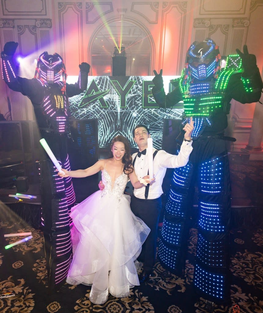 Sharon Zhang and Matt Shay made their wedding an EDM festival. Clane Gessel – <a href="https://clanegessel.com/" rel="nofollow noopener" target="_blank" data-ylk="slk:https://clanegessel.com/;elm:context_link;itc:0;sec:content-canvas" class="link ">https://clanegessel.com/</a>