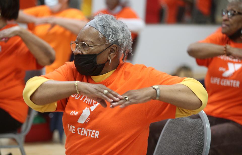 Essie Whren, 88, enjoys a silver Sneakers fitness class at the Thurston Road YMCA. 