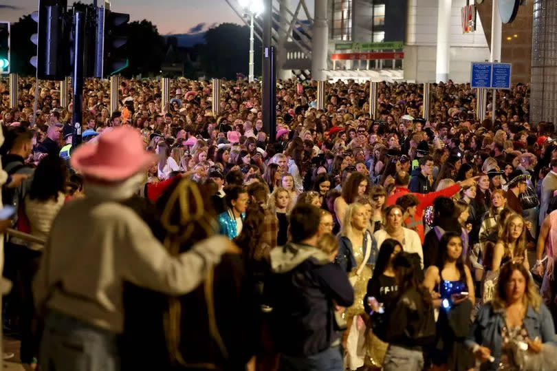 Fans queue as they leave the gig