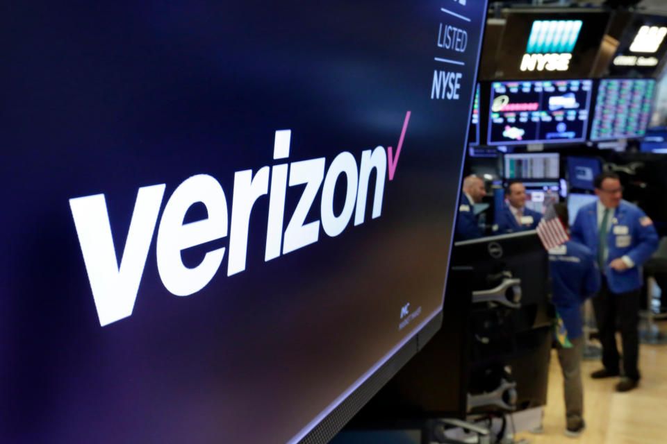 FILE- This April 23, 2018, file photo shows the logo for Verizon above a trading post on the floor of the New York Stock Exchange. Warren Buffett’s company made major new investments in Verizon and Chevron and again trimmed its huge stake in Apple while making several other adjustments to its stock portfolio last year. Berkshire Hathaway said in a regulatory filing Tuesday, Feb. 16, 2021, that it bought $8.6 billion worth of Verizon stock and picked up $4 billion worth of Chevron shares over the last six months of 2020. (AP Photo/Richard Drew, File)