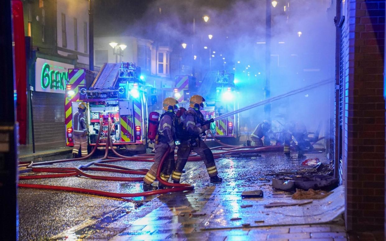 Firefighters battle the flames