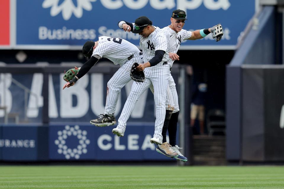 May 18, 2024; Bronx, New York, USA; New York Yankees left fielder Alex Verdugo (24) and right fielder Juan Soto (22) and center fielder Aaron Judge (99) celebrate after defeating the Chicago White Sox at Yankee Stadium. Mandatory Credit: Brad Penner-USA TODAY Sports