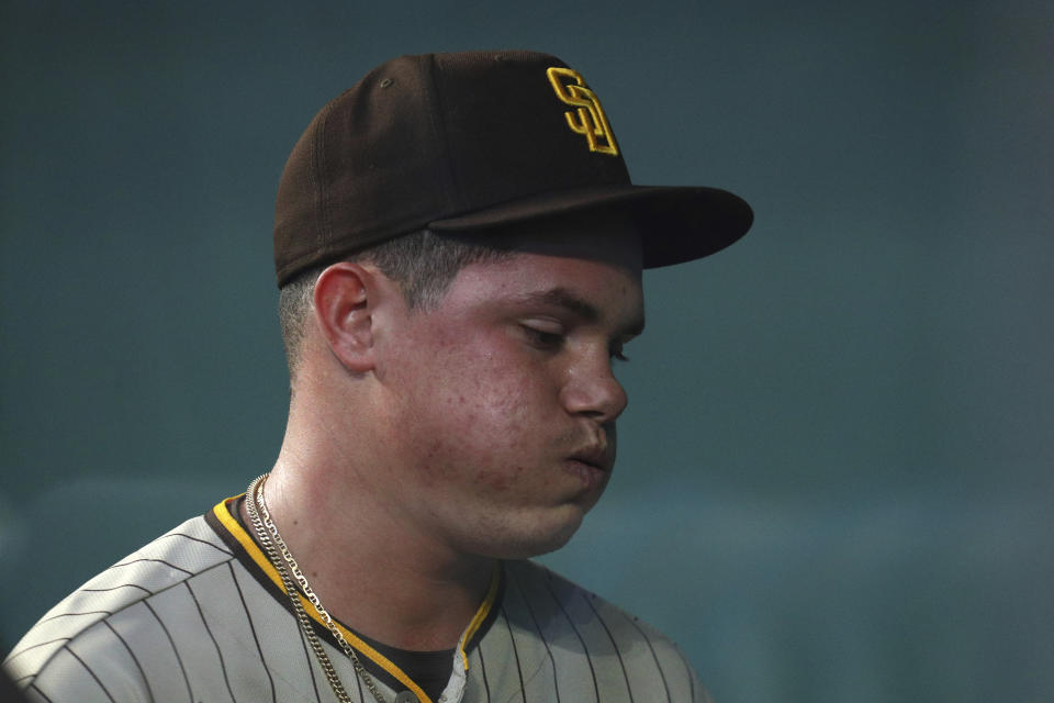 San Diego Padres starting pitcher Adrian Morejon reacts after leaving the baseball game against the Texas Rangers in the first inning on Sunday, April 11, 2021, in Arlington, Texas. (AP Photo/Richard W. Rodriguez)