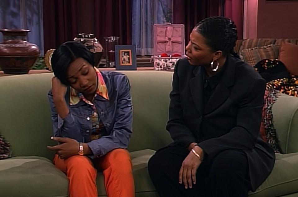 Monica looking distressed in a scene with Queen Latifah in "Living Single"