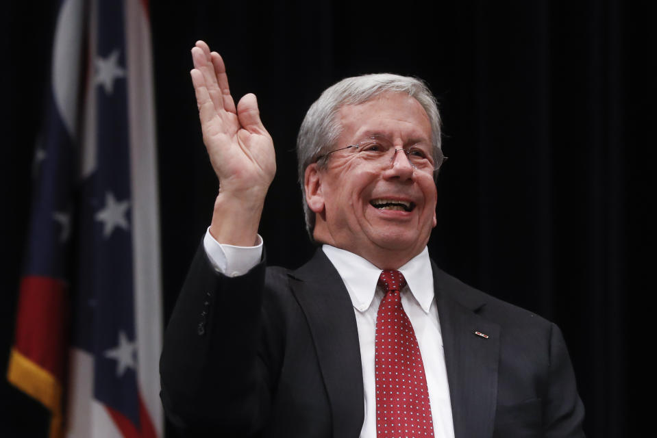 William O'Neill, former Ohio Supreme Court Justice, waves to the audience during the Ohio Democratic Party's fifth debate in the primary race for governor, Tuesday, April 10, 2018, at Miami (OH) University's Middletown campus in Middletown, Ohio. (AP Photo/John Minchillo)