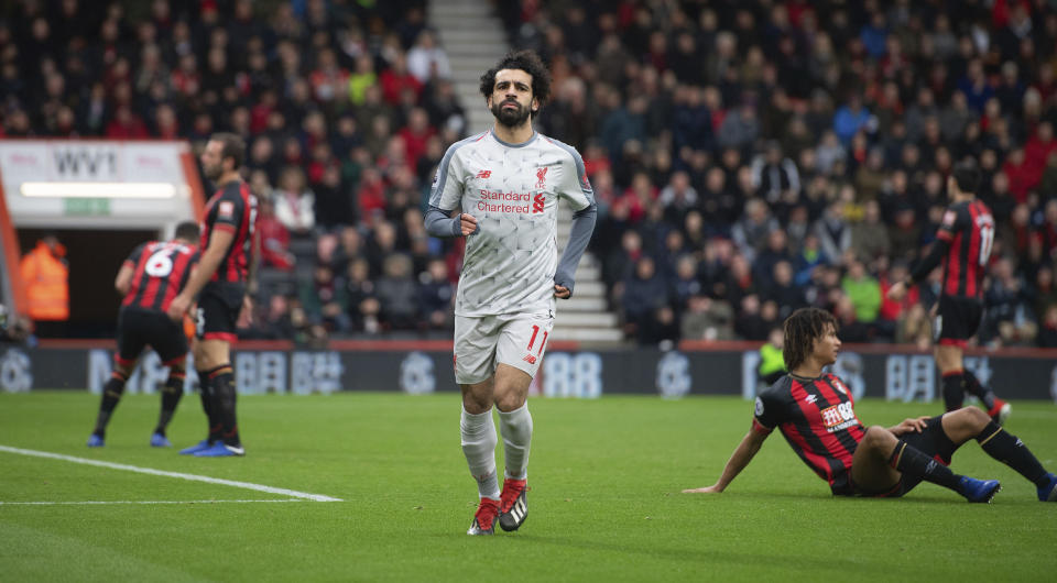 Liverpool's Mohamed Salah celebrates scoring his side's second goal of the game during their English Premier League soccer match against Bournemouth at the Vitality Stadium, Bournemouth, England, Saturday, Dec. 8, 2018. (Mark Pain/PA via AP)