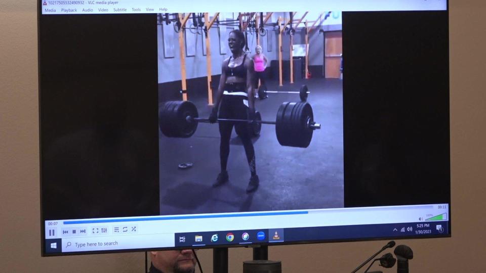 At trial, the defense team showed videos of Andreen McDonald powerlifting and carrying Andre McDonald on her back to demonstrate that she was stronger than him. / Credit: CBS News