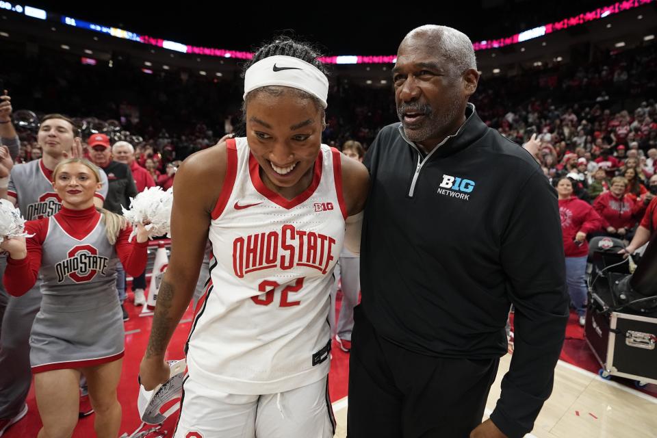 Ohio State forward Cotie McMahon celebrates with athletic director Gene Smith after winning the Big Ten women's basketball regular-season title on Feb. 28.