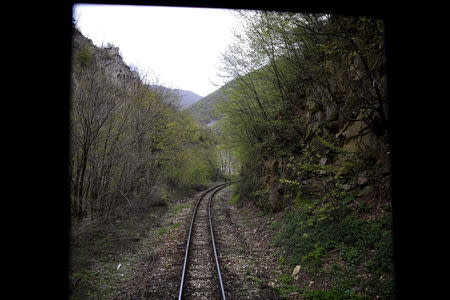 Railway tracks are seen trough the back door of a train traveling to Velingrad railway station, Bulgaria April 28, 2015. REUTERS/Stoyan Nenov