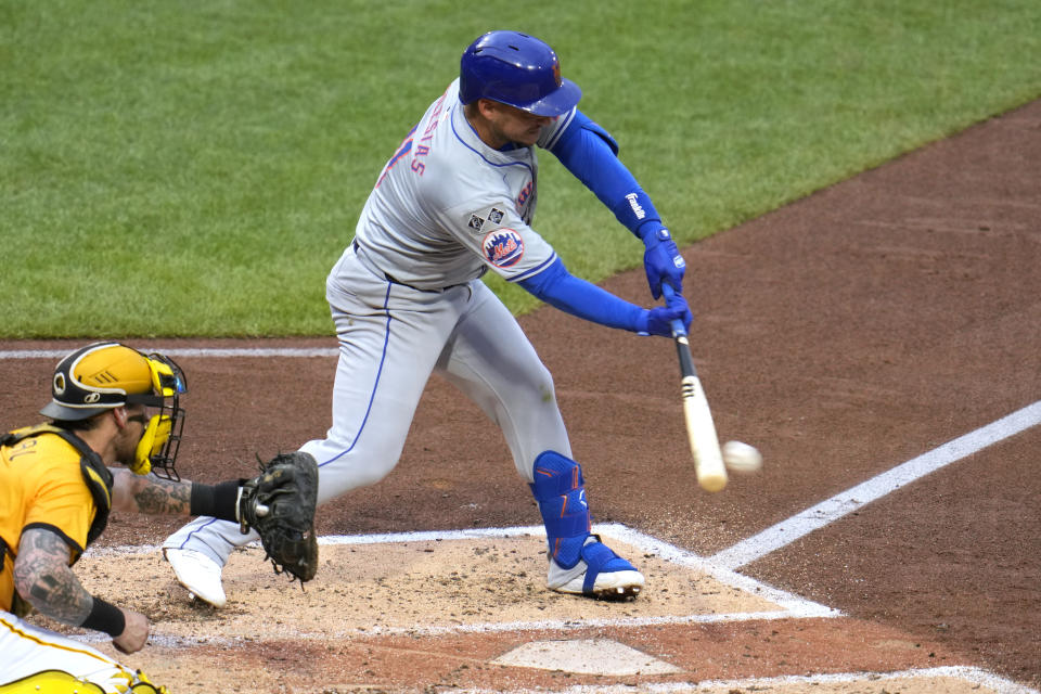 New York Mets' Jose Iglesias hits into a fielder's choice, driving in a run, during the fourth inning of a baseball game against the Pittsburgh Pirates in Pittsburgh, Friday, July 5, 2024. (AP Photo/Gene J. Puskar)