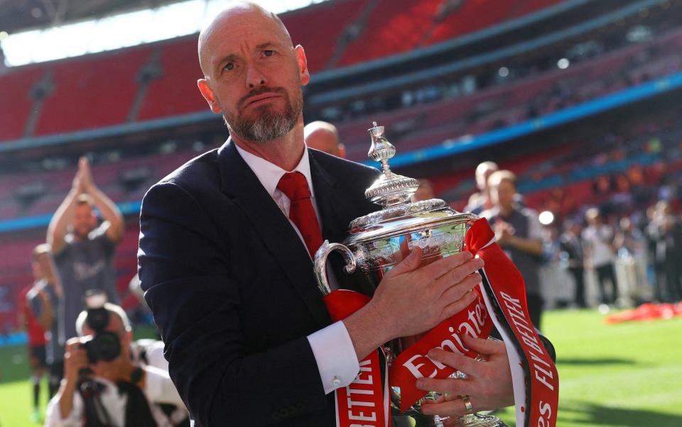 Erik ten Hag hugs the FA Cup