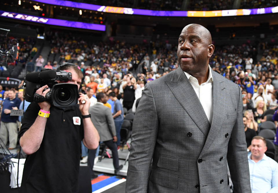 Magic Johnson is playing a high-stakes game in negotiations for Anthony Davis. What happens if he loses? (Getty)