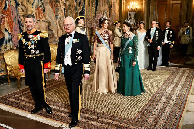 <p>Pontus Lundahl/Ritzau Scanpix/AFP/Getty</p> (From left)King Frederik, King Carl XVI Gustaf, Queen Mary and Queen Silvia of Sweden arrive for a banquet at the Royal Palace in Stockholm on May 6, 2024.