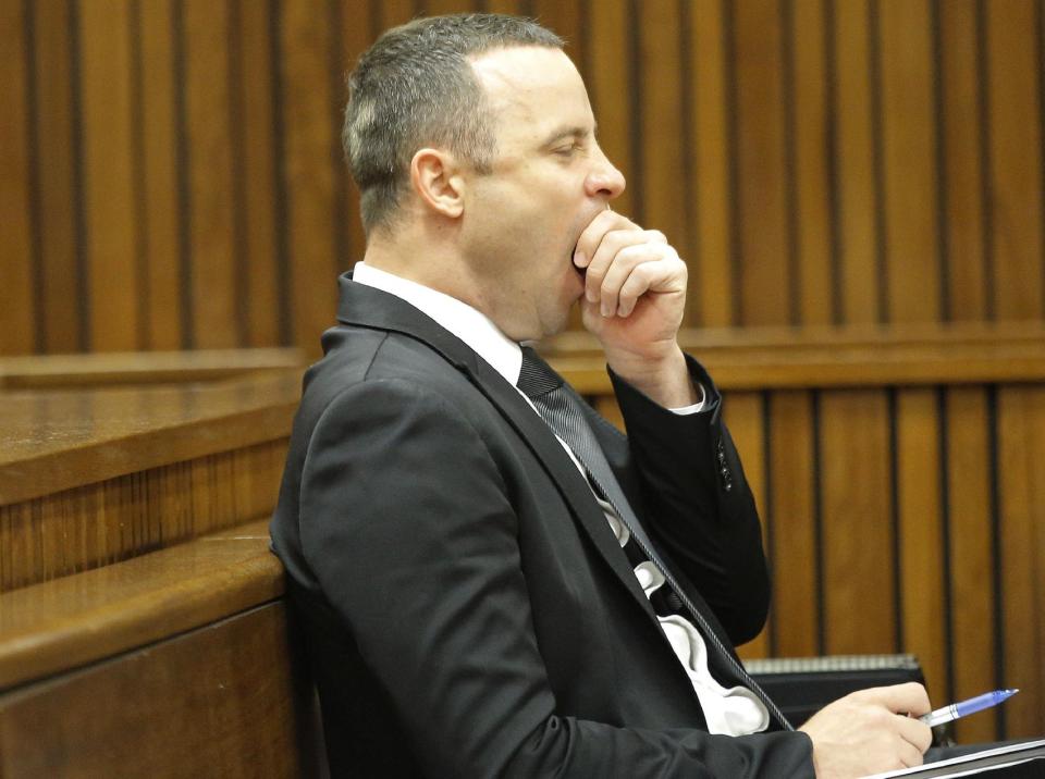 Oscar Pistorius yawns in a courtroom during his ongoing murder trial at the high court in Pretoria, South Africa, Monday, May 12, 2014. Pistorius is charged with the shooting death of his girlfriend Reeva Steenkamp on Valentine's Day in 2013. (AP Photo/Kim Ludbrook, Pool)