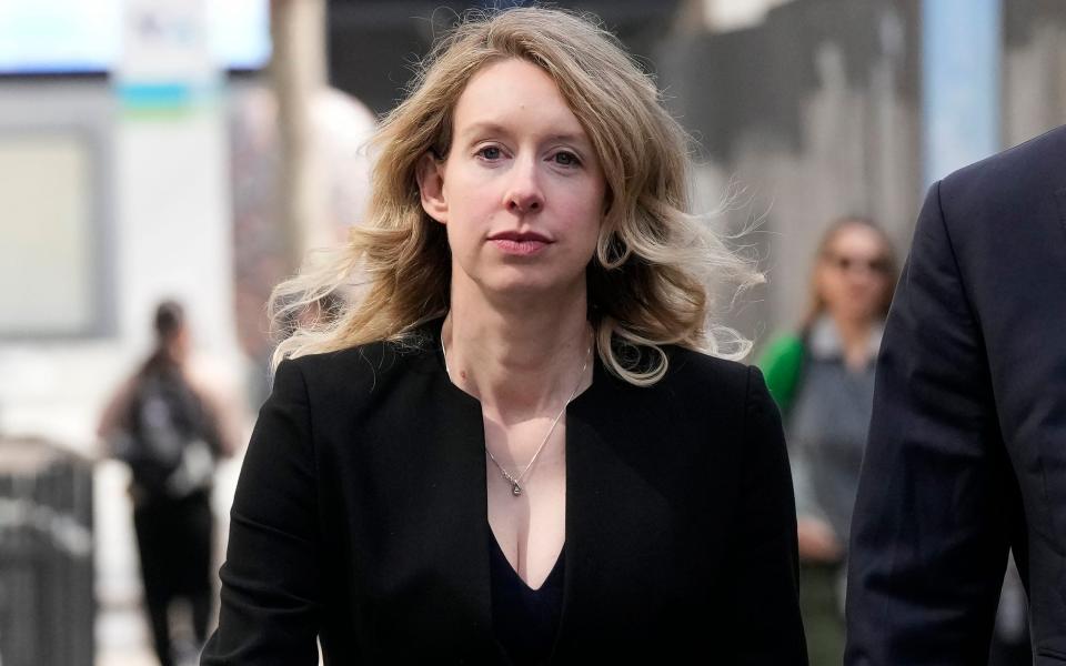 FILE - Former Theranos CEO Elizabeth Holmes leaves federal court in San Jose, Calif., March 17, 2023. Holmes has asked a federal judge, Wednesday, May 17, 2023, to allow her to remain free through the Memorial Day weekend before surrendering to authorities on May 30, to begin her more than 11-year prison sentence for defrauding investors in a blood-testing scam. (AP Photo/Jeff Chiu, File) - AP Photo/Jeff Chiu, File)