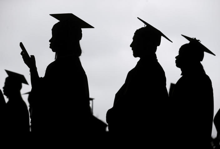 Graduates line up before the start of a community college commencement in East Rutherford, N.J., in 2018.  