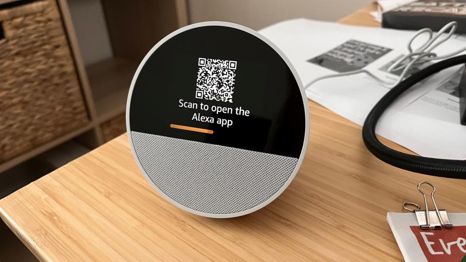 A photo showing the Echo Spot setup screen, which consists of a scannable QR code.