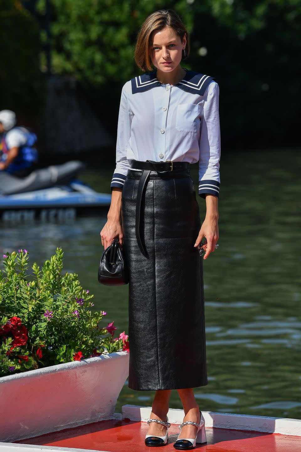 <p><strong>Wearing:</strong> Head-to-toe Miu Miu, complete with a sailor-inspired shirt and a leather midi skirt.</p><p><strong>Where:</strong> Venice Film Festival, September 2020.</p>