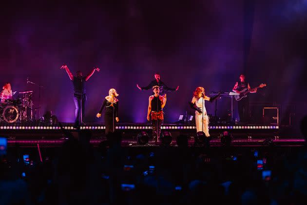 Kimberley Walsh, Olly Alexander and Nicola Roberts on stage during Years And Years' headline set at Mighty Hoopla on Sunday