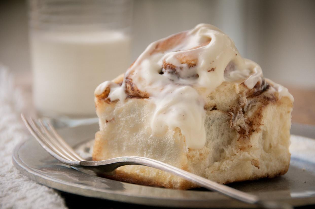 Closeup of a homemade cinnamon bun roll with icing