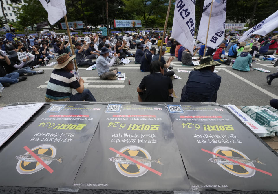 South Korean fishermen stage a rally against the planned release of treated radioactive water from the wrecked Fukushima nuclear power plant, in front of the National Assembly in Seoul, South Korea, Monday, June 12, 2023. The signs read "Oppose to release treated radioactive water from the Fukushima." (AP Photo/Ahn Young-joon)