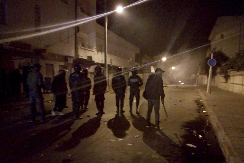 Tunisian Police officers patrol after clashes in the streets of Kasserine, southern of Tunisia, Tuesday, Dec 25, 2018.The death of a Tunisian journalist Abderrak Zorgui who set himself on fire to protest economic problems in the North African nation prompted a protest that led to clashes with police and nationwide concern. (AP Photo/Mohamed Ben Salah)