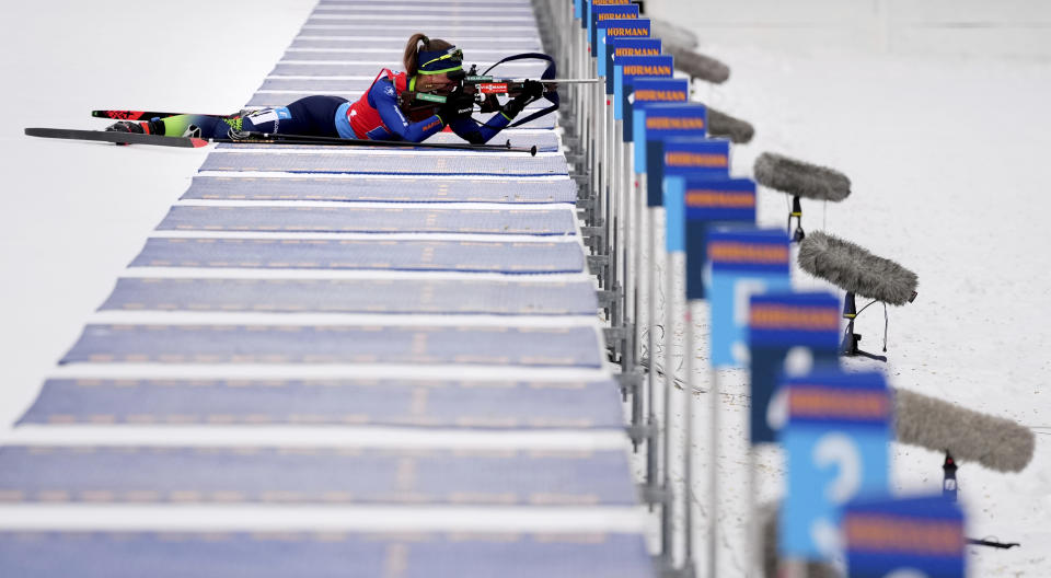 FILE - Joanne Reid of United States competes during the women's 4 x 6km relay race at the biathlon World Cup in Anterselva, Italy on Jan. 22, 2022. The United States Biathlon national champion was sexually harassed and abused for years by a ski-wax technician while racing on the sport's elite World Cup circuit, investigators found. When the two-time Olympian complained, Reid said she was told his behavior was just part of the male European culture. (AP Photo/Matthias Schrader, File)