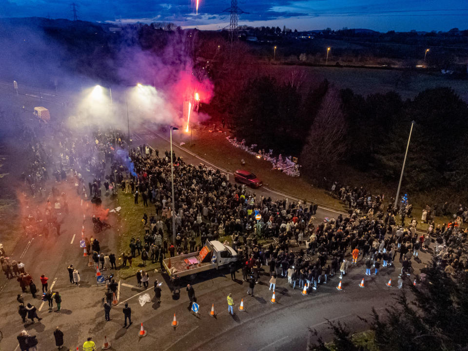 People attend a vigil in the St Mellons area of Cardiff, in memory of Eve Smith, 21, Darcy Ross, 21, and Rafel Jeanne, 24, who died in a road traffic accident, while Sophie Russon, 20, and Shane Loughlin, 32, survived but remain in a critical condition. Picture date: Tuesday March 7, 2023. (Photo by Ben Birchall/PA Images via Getty Images)