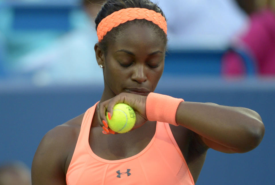 Sloane Stephens, from the United States, pauses between serves during a match against Maria Sharapova, from Russia, at the Western & Southern Open tennis tournament, Tuesday, August 13, 2013, in Mason, Ohio. (AP Photo/Michael E. Keating)