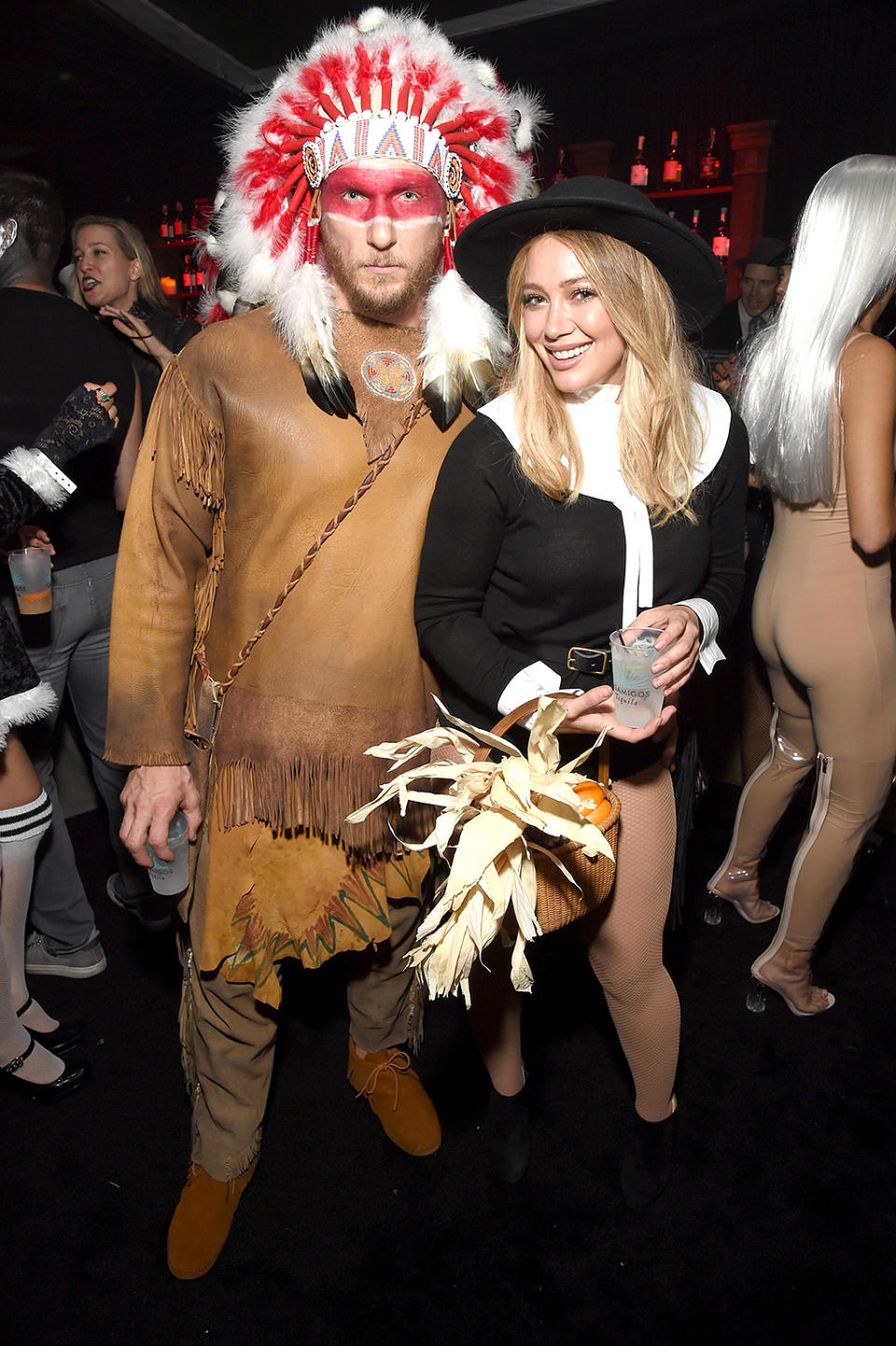 <p>Duff and her new beau, Jason Walsh, were excited to make their first public appearance as a couple, but unfortunately upset many with their politically incorrect, Thanksgiving-themed ensembles. (Photo: Michael Kovac/Getty Images) </p>