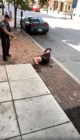 A man gets Tasered by a police officer, in Lancaster, Pennsylvania, U.S., June 28, 2018, in this still image taken from a video obtained from social media. Jay Jay/via REUTERS