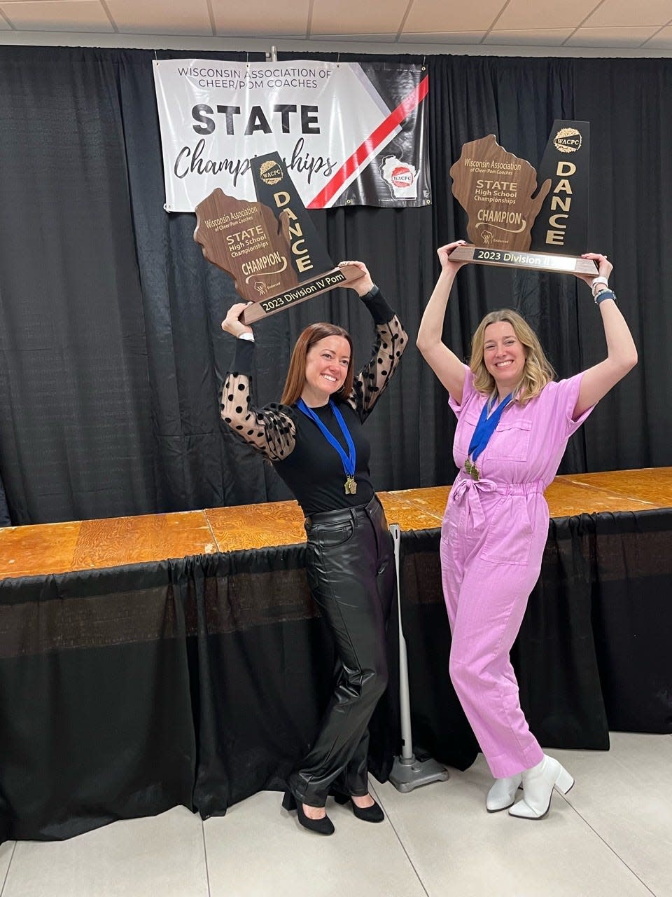 Katelyn Halstead, left, and Liz Wiskirchen are the two coaches for the New Berlin Eisenhower dance team and have led the team to dual state titles the last four years. The two are stepping down after coaching the team for 10 years.